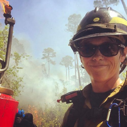 Katie Sauerbrey wearing a hard hat and smiling.