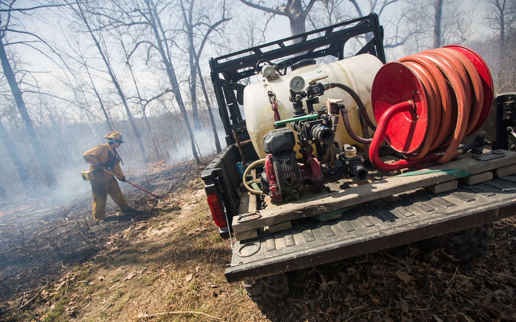 Kentucky Fire Management  A member of the fire crew “mops up” at the end of the prescribed burn.  © Mike Wilkinson