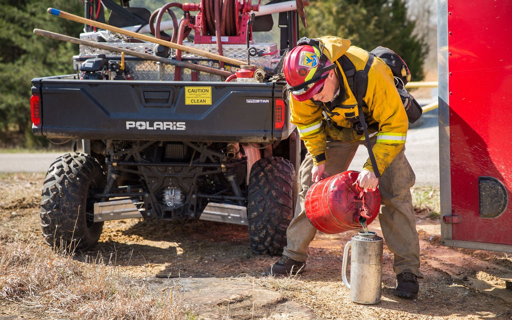 Kentucky Fire Management  Fuel is poured into a drip torch prior to the burn.  © Mike Wilkinson
