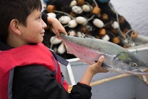 Boy with wild sockeye salmon