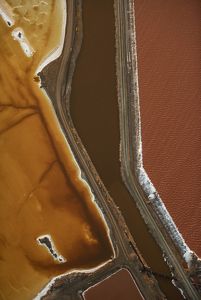 Aerial view of colorful salt ponds near San Francisco Bay.