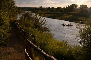 River against orange sunset.