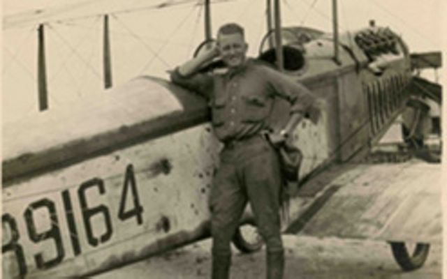 John Joseph Mathews poses in front of a plane during World War I.
