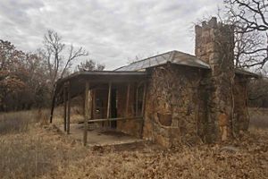 A cabin, owned by author and historian John Joseph Mathews, sits in disrepair. 