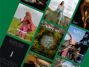 Several Nature Conservancy magazines laid out in rows.