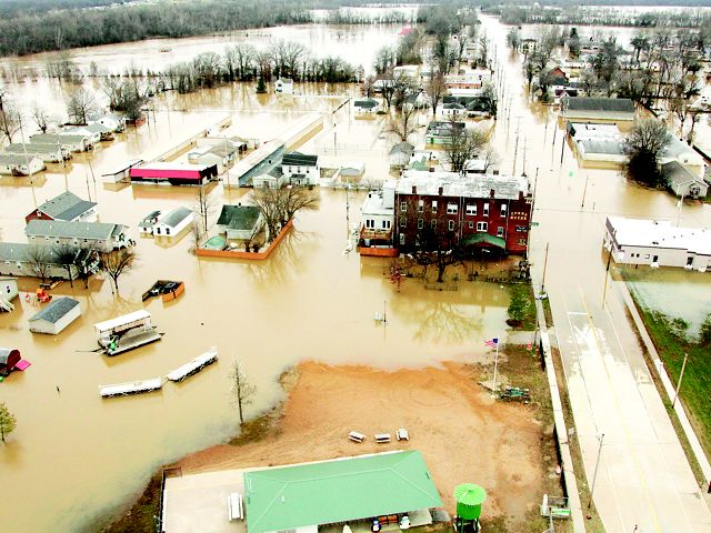 Aerial view of flooded houses and businesses.
