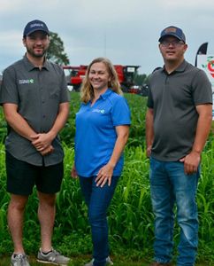 Simon Yevzelman, Rebecca Hagerman, and Jeff Bluemer of the TNC Soil Health team stand in a farm field. 
