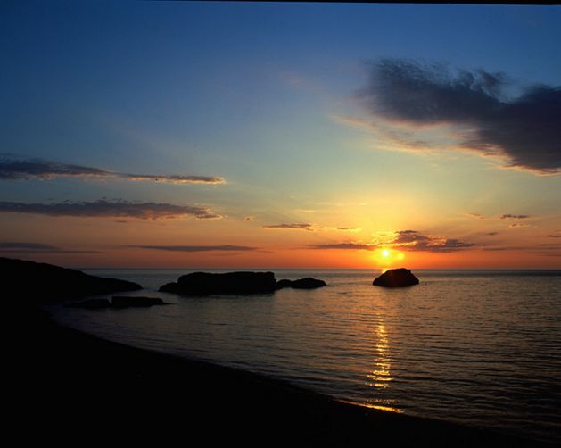 A sunset over a lake.