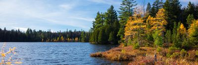 On the left is a calm Michigan lake, surrounded by autumn trees. On the right is the question: On average, water makes up what percentage of beer?