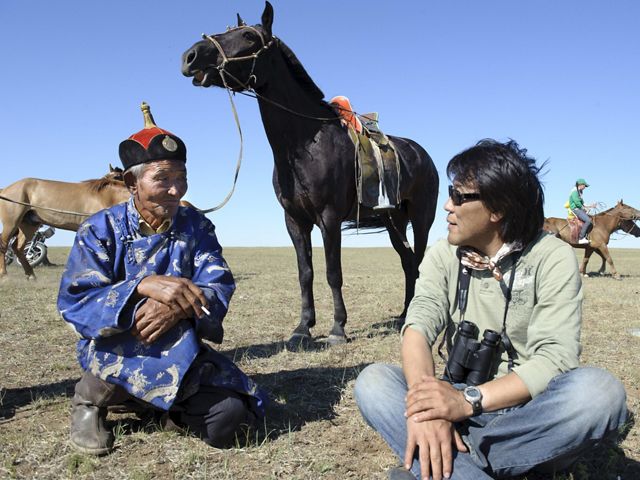 Galbadrakh (Gala) Davaa, (on right - Director of Conservation for the Conservancy's Mongolia Program) talks with a Mongolian elder who is there to oversee area youth as they practice horse racing for a traditional Mongolian Naadam festival. The rich natural resources of Mongolia’s steppes are attracting increased development, which is threatening the balance between humans and wildlife that has defined this country’s past. Through traditional land protection and initiatives like Development by Design, the Conservancy is working to create a sustainable future that honors and preserves the sustainable culture of Mongolia’s grasslands.
