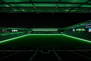 Sporting Kansas City stadium with all green lighting.