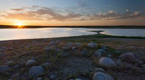 Sun sets over a lake.