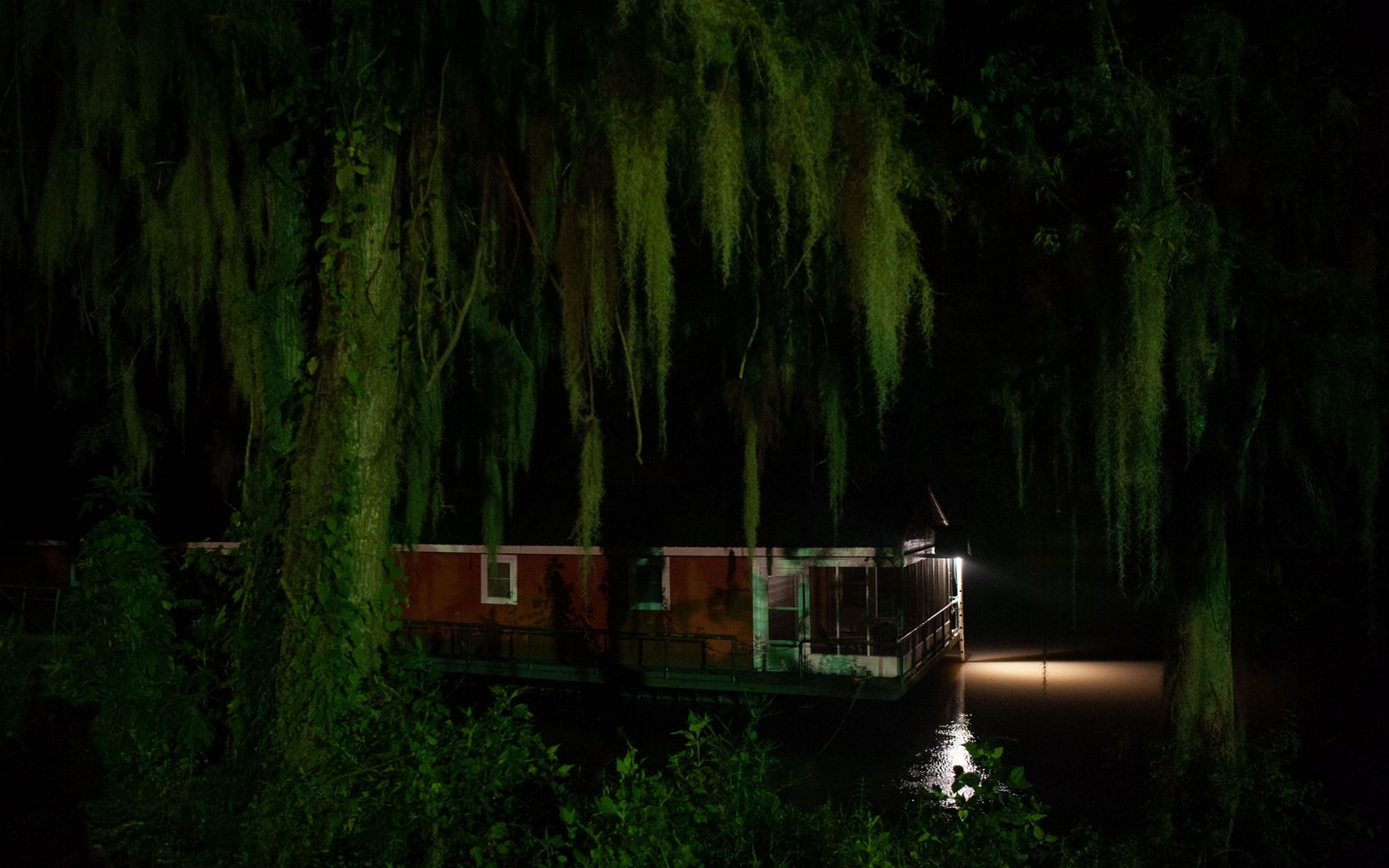 
                
                  Conservation Center at Night TNC's Atchafalaya Conservation Center is a converted barge floating near Bayou Sorrel. Floating homes and shelters are popular in this region.
                  © Rory Doyle
                
              