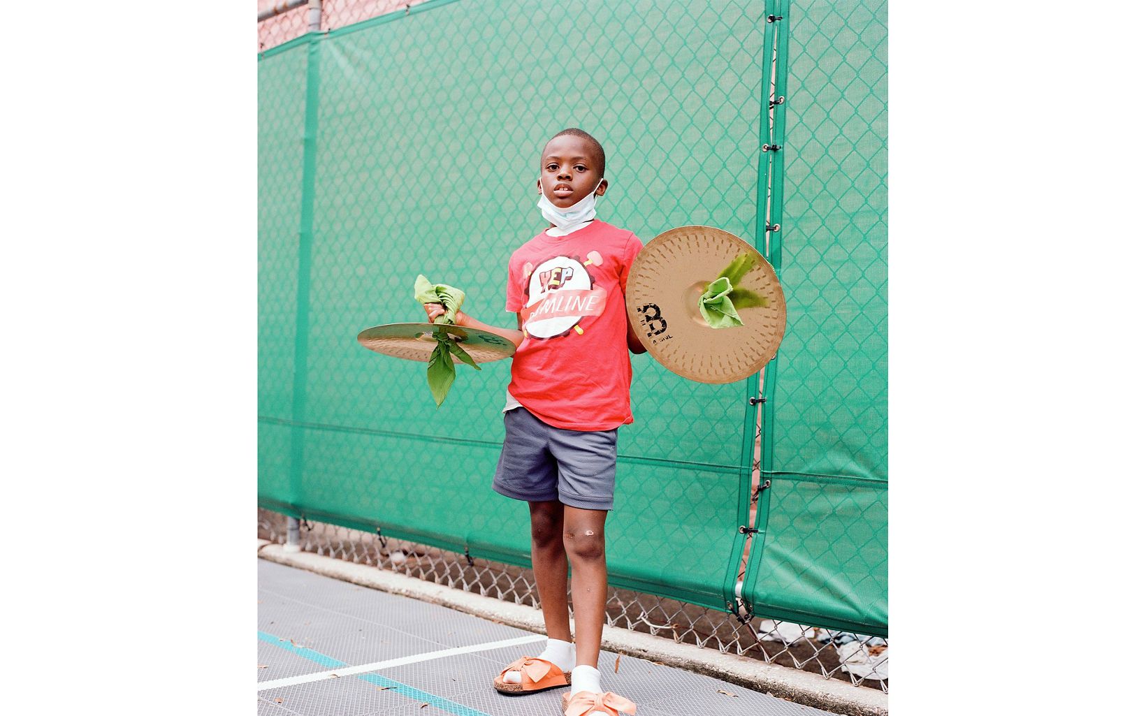 
                
                  Crashing Success A young cymbalist from the Youth Empowerment Project Dance and Music Team. This program works to empower children in Central City via the Second Line music tradition.
                  © Akasha Rabut
                
              