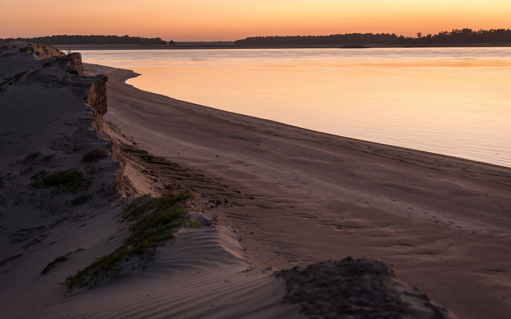 
                
                  Sunset Sandbar The sun sets on sandbar ledges on the banks of the Mississippi River near Farrell, Mississippi.
                  © Rory Doyle
                
              