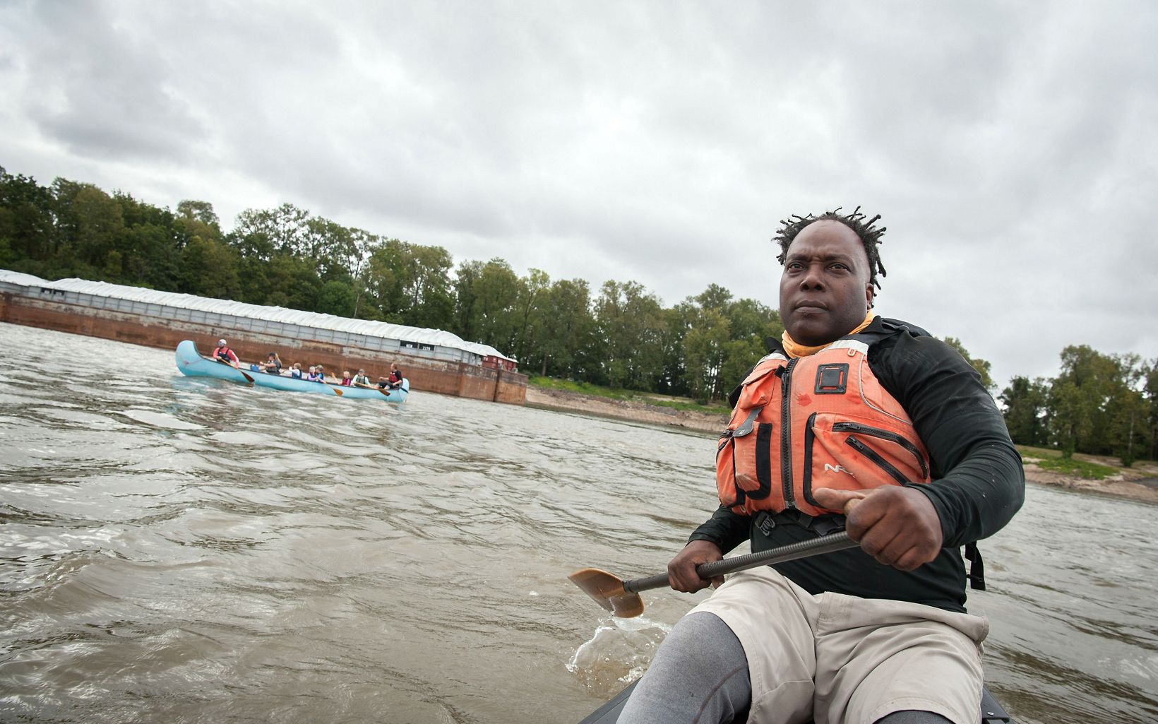 
                
                  Namesake Mark "River" Peoples leads a canoe trip on the Mississippi. Peoples, a former NFL player who grew up next to the river,  has made it his mission to advocate for the river.
                  © Rory Doyle
                
              