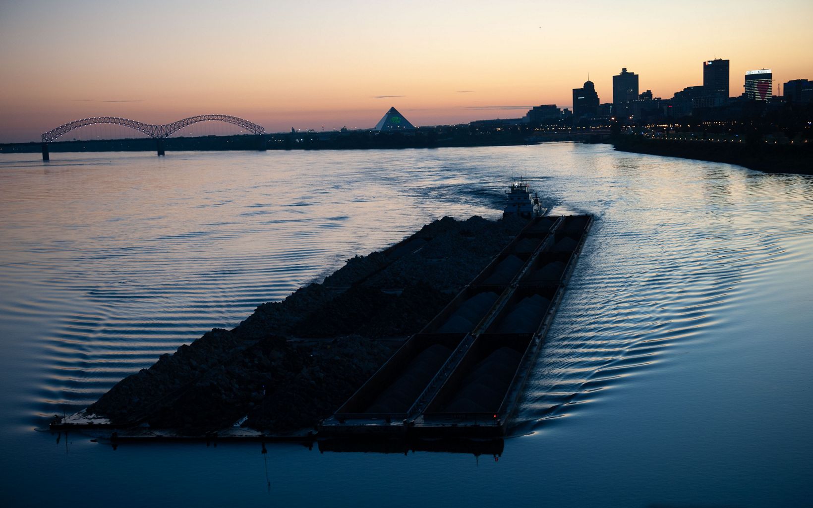 
                
                  Transportation Lifeline A barge makes its way downstream in Memphis. The Mississippi River is a source of industrial work throughout the basin and many people rely on it for economic sustenance.
                  © Rory Doyle
                
              