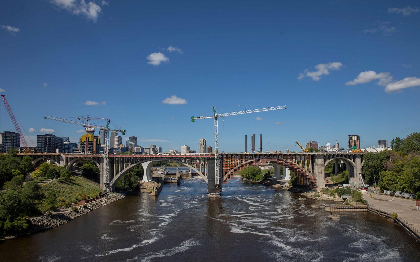 
                
                  Big Cities A bridge under construction near downtown Minneapolis. The Twin Cities were founded because of the nearby juncture of the Mississippi and Minnesota Rivers.           
                  © Ackerman + Gruber
                
              