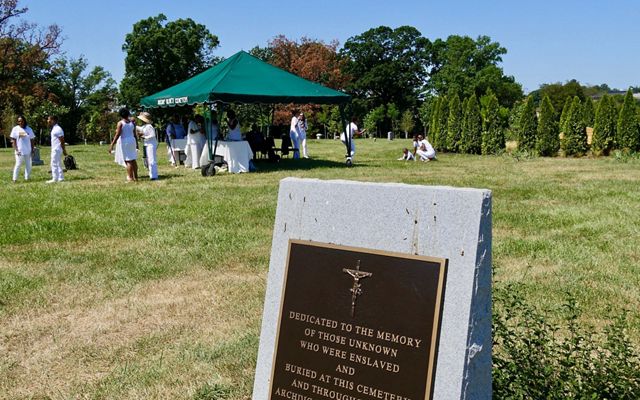 Descendants of freedmen John and Arabella Weems gather at Mt. Olivet Cemetery to honor the legacy of their ancestors, August 9, 2019.