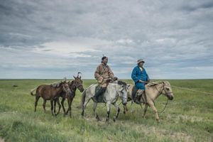Two herders in Eastern Mongolia's Tosonhulstai Nature Reserve.