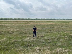 Chad Bladow stands in the same spot from his first photo 25 years later.