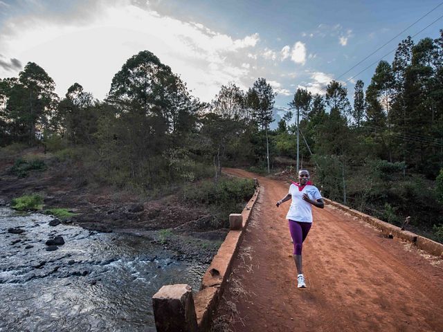 Jane Mbogo runs an average of 28 kilometers a day, meeting farmers and talking to them about the Upper Tana-Nairobi Water Fund.