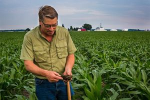 Farmer Les Seiler demonstrates healthy soil.