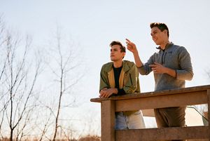 Chad Duplain stands on bridge with partner Matthew at Big Darby Headwaters Nature Preserve.