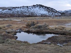Pond at the bottom of a mountain.