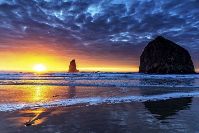Photo of brilliant orange sunset skies on Oregon coast.