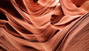 Abstract view of the red flowing rocks of a slot canyon