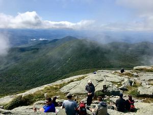Wind turbine over a large body of water.
