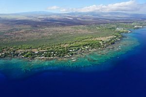 A coral reef spans the Puakō, Hawai‘i coastline.