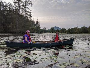 Two women in a kayak.