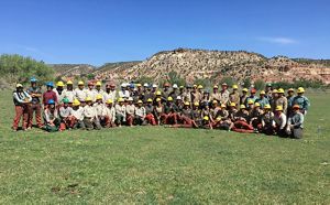 Group photo of more than 50 restoration crew members.