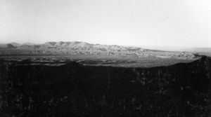A black and white image of rolling mountains.