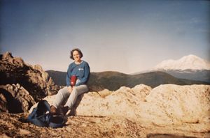 Samantha Horn sitting at a rocky overlook.