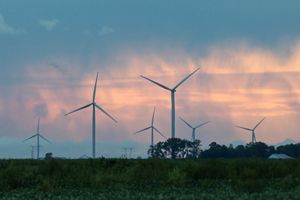 Wind turbines against a morning sky.