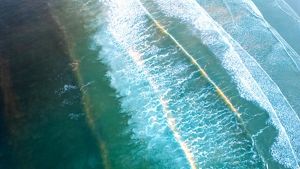 Aerial view of waves in the ocean.