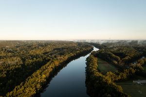 Aerial view of the Cape Fear River and surrounding forest.