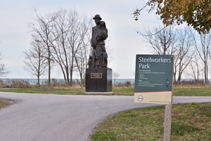 A statue sits next to a pathway at Chicago's Steelworkers Park. 