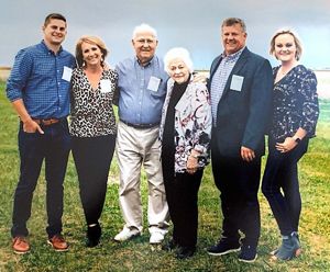 Six members of the Strasburger family in a field.