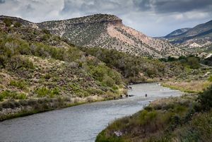 The Rio Grande river with a kayaker in the distance.