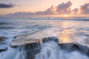 Rocky Florida ocean shoreline at sunrise.  