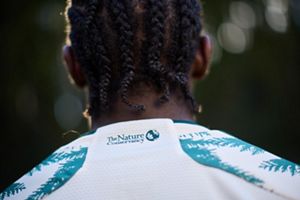 The Portland Timbers unveil their new community fit featuring The Nature Conservancy's logo. 
