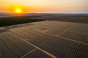 Aerial image of solar array during a sunset. 