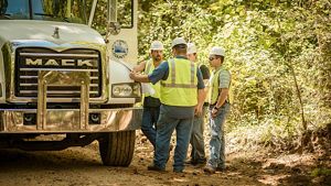 workers in the Arkansas Unpaved Roads Program