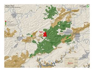 A map uses the color red to show where a recently protected tract is located within a larger land protection area.