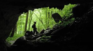 People explore a cave.