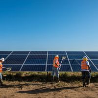 Workers clean solar panels for maximum efficiency at the power solar facility in Lancaster, California.   